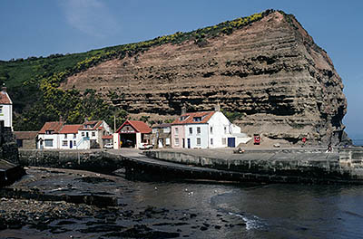 ENG: Yorkshire & Humberside Region, North Yorkshire, North Yorkshire Coast, Sea Cliffs, Straithes, VIew of this fishing village under sea cliffs. [Ask for #133.072.]