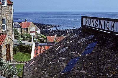 ENG: Yorkshire & Humberside Region, North Yorkshire, North Yorkshire Coast, Sea Cliffs, Runswick Bay, Quay and life boat station; village beneath cliffs [Ask for #133.084.]