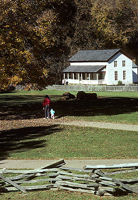 TN: The Great Smoky Mtns Region, Blount County, Great Smoky Mountains Nat. Park, Cable Mill Area, Cades Cove, Gregg-Cable House, Viewed over split rail fence. Fall colors. [Ask for #142.083.]