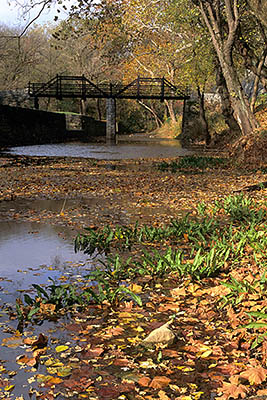 WV: Jefferson County, Potomac River Area, Harpers Ferry Nat. Hist. Park, Virginius Island, Abandoned 19th C canal & wharf; footbridge [Ask for #194.047.]