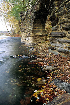 WV: Jefferson County, Potomac River Area, Harpers Ferry Nat. Hist. Park, Virginius Island, Abnd 19th C watermill by Shenandoah River. Ruined arch in river [Ask for #194.050.]