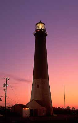 Tybee Island, near Savannah.  Tybee Island Lighthouse at dusk, with  Christmas decorations. Location: GA: Chatham County. [ref. to #196.014]