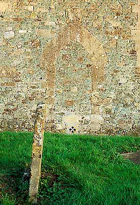 ENG: South West Region, Wiltshire, North Wessex Downs AONB, The Vale of Pewsey, The Altons, Alton Priors. Medieval chapel; detail of wall and grave [Ask for #198.032.]