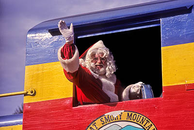 "Santa" Mack Davis from train engine window, at the Santa Train event. REL. Great Smoky Mountains Railway. Location: NC, Jackson County, Balsam Mountains, Dillsboro. [ref. to #205.095]