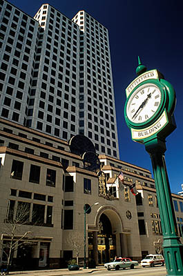 Congress St. One American Center, with the Littlefield Bldg. street clock in frgd. Location: TX, Travis County, Austin, Downtown. [ref. to #208.032]