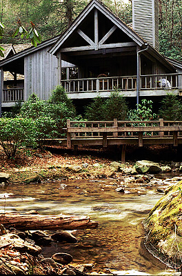 Cedar Creek Woods; Lewis Residence, by Greene & Assoc. Back of house; rear porch and deck extending over stream. NR. Location: NC, Jackson County, The Blue Ridge Mountains, Cashiers, Residential Neighborhoods. [ref. to #210.007]