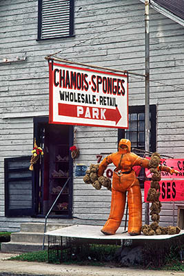 Sponge and Chamois wholesaler with orange diver suit in front. Location: FL, Pinellas County, Clearwater/Dunedin Area, Tarpon Springs. [ref. to #217.039]