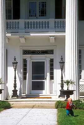 NC: Brunswick County, Cape Fear River Area, Southport Vicinity, Orton Plantation, Easter Egg Hunt. Baby in front of plantation house.  [NOT RELEASED] [Ask for #224.105.]