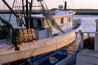 NC: Brunswick County, Cape Fear River Area, Southport, Fishing boat "Cape Fear" in sunset light [Ask for #224.157.]