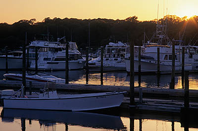 Sun setting behind yachts. Location: NC, New Hanover County, Wilimington Area, Wrightsville Beach. [ref. to #224.207]