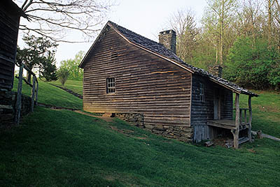 The Blue Ridge Parkway, Doughton Park, Brinegar Cabin. Front view, in dusk light. Location: NC, Wilkes County. [ref. to #226.058]