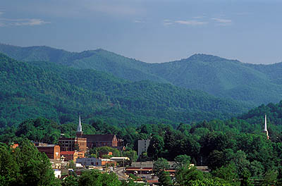 View of small town surrounded by the forested slopes of Balsam Mountain, in the Pisgah National Forest. Location: NC, Haywood County, Waynesville Area, Waynesville. [ref. to #227.231]