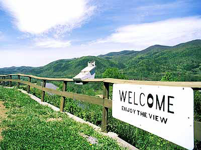 View over the French Broad River and the Bald Mountains, from a roadside overlook on Old US 70 maintained by a local resident. Location: NC, Madison County, The Bald Mountains, Hot Springs. [ref. to #232.123]