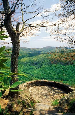 View east across the Catawba River Valley, towards Linville Mountain, showing the overlook; spring buds on trees. Location: NC, McDowell County, The Blue Ridge Parkway, Chestoa View Overlook (MP 321). [ref. to #232.340]