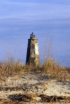 Viewed from West Beach, across dunes. Location: NC, Brunswick County, Cape Fear Area, Bald Head Island, Bald Head I. Lighthouse (Old Baldy). [ref. to #233.061]