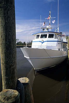 NC: Brunswick County, Cape Fear River Area, Southport, Bald Head Island Ferry Terminal at Indigo Plantation & Marina; ferry "Sans Souci" at dock. [Ask for #233.073.]