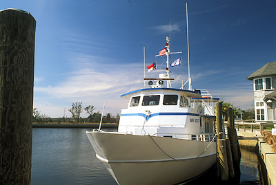 The mainland Bald Head Island Ferry Terminal at Indigo Plantation & Marina; ferry "Sans Souci" at dock. Location: NC, Brunswick County, Cape Fear River Area, Southport. [ref. to #233.074]