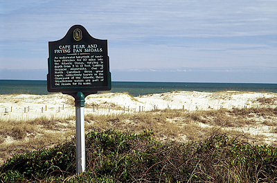 Historic plaque on beach dune in front of Cape Fear. Location: NC, Brunswick County, Cape Fear River Area, Bald Head Island, Cape Fear. [ref. to #233.123]