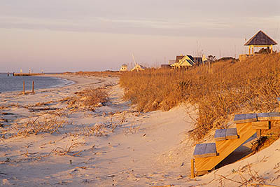 View up West Beach, showing houses, in sunset light. Location: NC, Brunswick County, Cape Fear Area, Bald Head Island, West Beach. [ref. to #233.176]