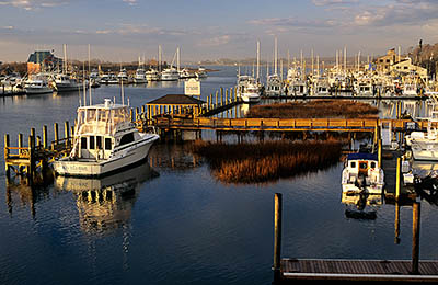 Yachts line the Intracoastal Waterway at the bridge between Wrightsville Beach & Wilmington. Location: NC, New Hanover County, Wilimington Area, Wrightsville Beach, Intracoastal Waterway. [ref. to #233.180]