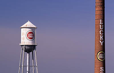 Tobacco factory; Lucky Strike logo on water tower & brick chimney. Location: NC, Durham County, Tri-Cities Area, Durham, Downtown. [ref. to #233.703]