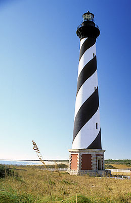 Cape Hatteras Lighthouse, viewed from north over sand dunes. Location: NC, Dare County, The Outer Banks, Hatteras National Seashore. [ref. to #233.A29]