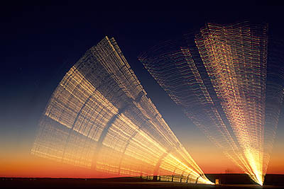 NC: Dare County, The Outer Banks, Nags Head & Kitty Hawk, on Bodie Island, Jockeys Ridge State Park, Annual "Kites With Lights" event, sponsored by Kitty Hawk Kites. People flying lighted kites at dusk, from a dune top. [Ask for #233.A96.]