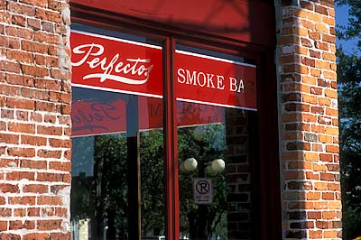 Perfectos Smoke Bar, a cigar bar in a 19th Cent. storefront by Ybor Square; 19th C. ball streetlight in bkgd. Location: FL, Hillsborough County, Tampa, Ybor City. [ref. to #234.313]