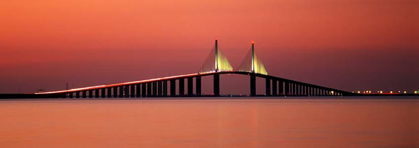 The Sunshine Skyway, viewed at dusk from across Tampa Bay. Location: FL, Pinellas County, Tampa Bay, St. Petersburg, The Sunshine Skyway. [ref. to #234.409]