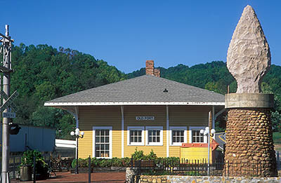 NC: McDowell County, Marion Area, Old Fort, Railroad Depot, viewed from east,  now a history museum. Statue of a flint arrowhead, marking the former route of the Daniel Boone Hwy. [Ask for #237.597.]