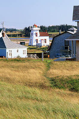 PE: Queens County, Anne's Land Area, North Rustico Harbor, North Rustico Lighthouse. View towards village, showing foot path over sand dunes. [Ask for #240.100.]