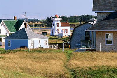 PE: Queens County, Anne's Land Area, North Rustico Harbor, North Rustico Lighthouse. View towards village, showing foot path over sand dunes. [Ask for #240.101.]