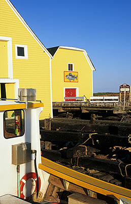 PE: Queens County, Anne's Land Area, North Rustico Harbor, Court Bros. fishing warehouses, on the docks. View over lobster traps to the rear dock area. [Ask for #240.108.]