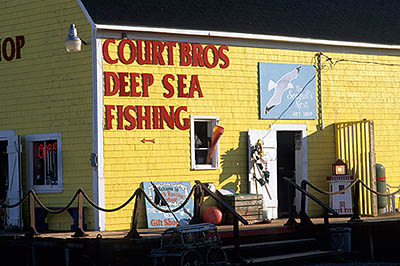 PE: Queens County, Anne's Land Area, North Rustico Harbor, Court Bros. fishing warehouses, on the docks. One of the warehouses converted to a gift shop. [Ask for #240.110.]