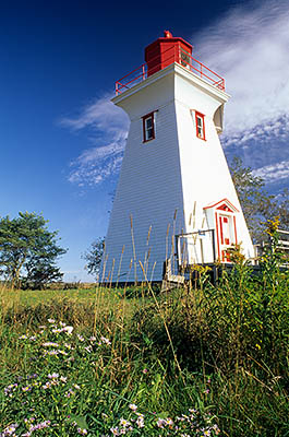 Prince Edward Island, Canada. Victoria Lighthouse, framed by fall wildflowers. Location: PE, Queens County, Charlotte's Shore Area, Victoria. [ref. to #240.216]