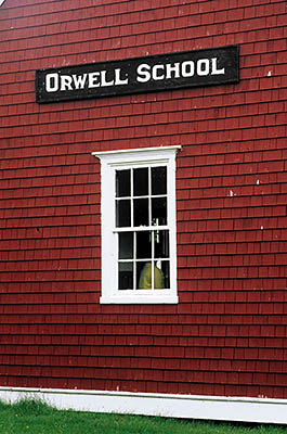 PE: Queens County, Hills & Harbours Area, Orwell Center, a recreated village, Orwell village school; exterior, with sign. [Ask for #240.264.]