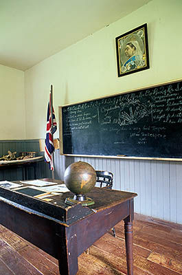 PE: Queens County, Hills & Harbours Area, Orwell Center, a recreated village, Orwell village school; interior; furnished as in late 19th C. with Union Jack and portrait of Queen Victoria. [Ask for #240.267.]