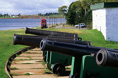 PE: Queens County, Hillsborough River Area, Charlottetown, Victoria Park; restored 18th C. gun emplacement, with red double decker bus in bkgd. [Ask for #240.269.]