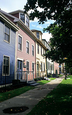 PE: Queens County, Hillsborough River Area, Charlottetown, Brightly colored attached wood houses line Great Georges Street in downtown. [Ask for #240.278.]