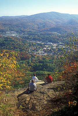 NC: Watauga County, Boone Area, Rich Mountain, Howard Knob Park, View from Howard's Knob towards Boone and Appalachian State University; college students studying on cliff's edge [Ask for #242.081.]