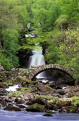 Stone foot bridge by a waterfall, known locally as the "Roman Bridge". Location: UK, Scotland, Perth & Kinross District, Grampian Mountains, Glen Lyon. [ref. to #243.471]