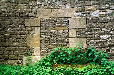 Blocked doorway in stone wall has a capstone with an 18th c. date. Location: ENG, Staffordshire , Peak National Park, Alstonefield. [ref. to #246.351]