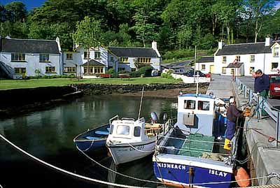 Tiny village viewed from its harbor; fishermen talking on quay. Location: UK, Scotland, Argyll & Bute , Inner Hebrides, Islay, Port Askaig. [ref. to #246.516]