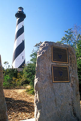 NC: Dare County, The Outer Banks, Hatteras National Seashore, Cape Hatteras Lighthouse, Viewed over commemorative monuments, in its new location [Ask for #249.005.]