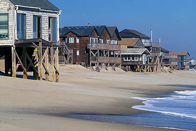 NC: Dare County, The Outer Banks, Hatteras Island, Rodanthe, Stilt vacation homes being damaged or destoyed by beach erosion; the closest is abandoned and below high tide. [Ask for #249.077.]