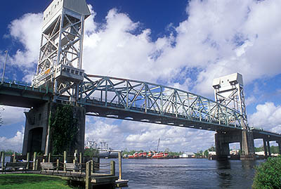 NC: New Hanover County, Cape Fear River Area, Wilmington, Wilmington Seaport, Riverside Park; view towards Capes Fear Memorial Bridge (US 17) and the Cape Fear River [Ask for #249.358.]