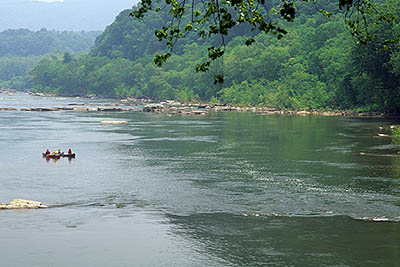 WV: Jefferson County, Potomac River Area, Harpers Ferry Nat. Hist. Park, Old Town, Canoeists on the Potomac River, as viewed from the wharf [Ask for #251.286.]