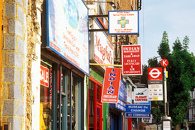 Businesses on Earls Court Road (A3220), a colorful gathering point for travelers and backpackers. Location: ENG, Greater London , Borough of Kensington and Chelsea, Earls Court. [ref. to #253.319]