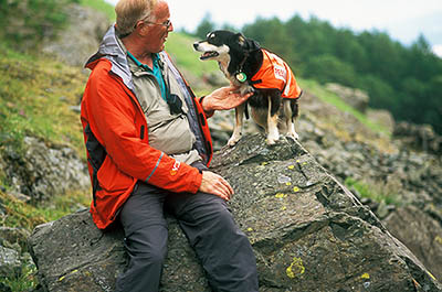 Search and Rescue Dogs Assoc. (Lake District) training session. Handler Mick Guy with search dog Mist. Location: ENG, Cumbria , The Lakes District National Park, Keswick-Borrowdale Area, Broadstack Gil in Borrowdale (NT). [ref. to #259.149]