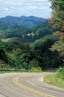 NC: Watauga County, Rich Mountain, Lower Slopes and Valleys, Straddle Gap, View from the gap over farmlands to the crest of Rich Mountain; the paved country lane follows the exact path of Boone's Trace, a Colonial era road. [Ask for #260.258.]